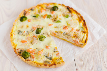 smoked salmon, Brussels sprouts and gorgonzola quiche tart, top view