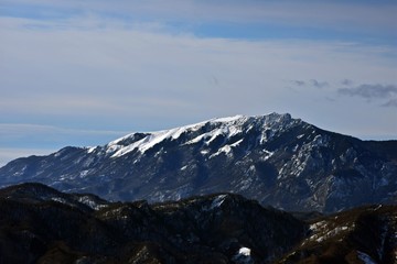 Fototapeta na wymiar snowy mountains in winter season on sunny day at high altitude