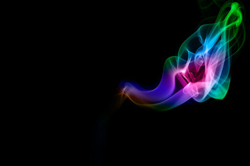 Abstract colored smoke on black background