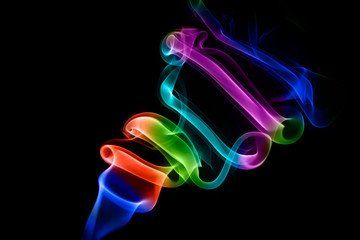 Abstract colored smoke on black background