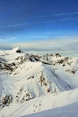 snowy mountains in winter season on sunny day at high altitude