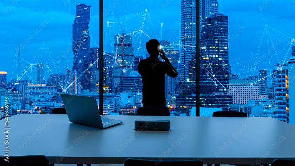 Poster businessman standing using smart phone and business wireless network in office desk and windows and 
