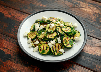 Warm salad with grilled zucchini, garlic and herbs