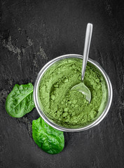 Homemade spinach powder (close up; selective focus)