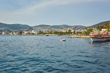 Fototapeta premium View of Bodrum Beach, Aegean sea, traditional white houses, flowers, marina, sailing boats