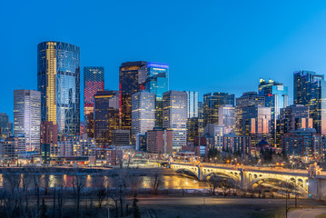 View of Calgary's beautiful skyline at night along the Bow River. 