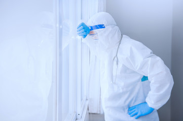 doctor wearing protective suit to fight coronavirus pandemic covid-2019. Portrait doctor in protective PPE suit.