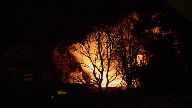 Big Fire of Two Houses Burning During the Night. Huge Flames.