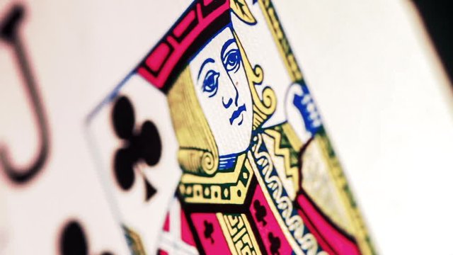 macro of a jack of clubs playing card coming into focus