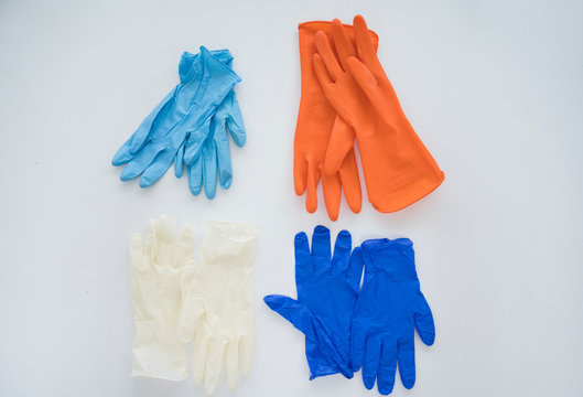 Different gloves isolated on white background.Personal protective tool for  against infection disease.Medical accesory for infectious control concept.  Stock Photo | Adobe Stock