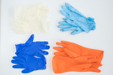 Different gloves isolated on white background.Personal protective tool for against infection disease.Medical accesory for infectious control concept.