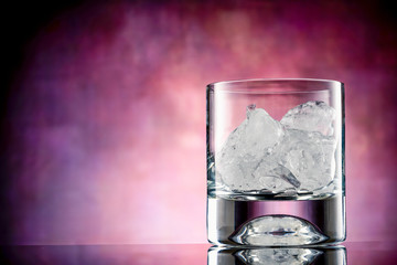 Empty whiskey glass with ice  cubes