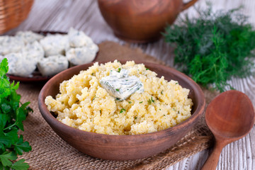 Millet porridge with butter and parsley