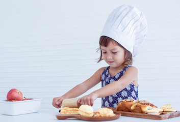 A little girl is making bakery