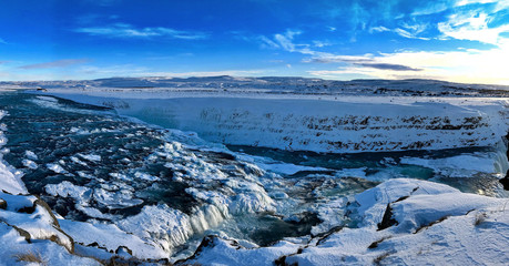 snowy waterfall landscape scene in Iceland