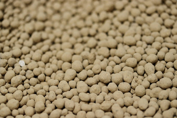 Magnesium lime fertilizer or fertiliser background, chemical granulated fertilizer closeup. Macroelements and microelements for agricultural plants