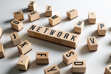 " network " text made of wooden cube on  White background with pile words.
