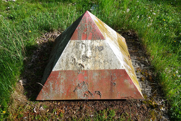 Protective metal cover for a hydrant in the ground in the shape of a pyramid
