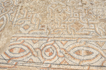 Archaeological remains with decorative tile floors and frescoes paintings in a hillside house on the slopes of the ancient city ruins of Ephesus