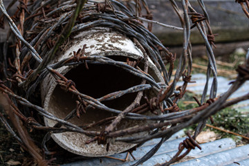 Barbed wire wrapped around PVC pipe