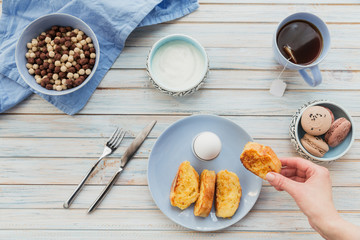 French fried toast with tea, boiled eggs and fresh yogurt. Tasty farmer breakfast.