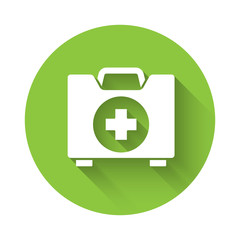 White First aid kit icon isolated with long shadow. Medical box with cross. Medical equipment for emergency. Healthcare concept. Green circle button. Vector Illustration