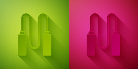 Paper cut Jump rope icon isolated on green and pink background. Skipping rope. Sport equipment. Paper art style. Vector Illustration