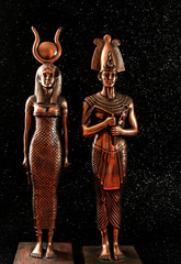 Pharaoh Tutankhamun with the goddess ISIS on a black background. Egyptian history.
