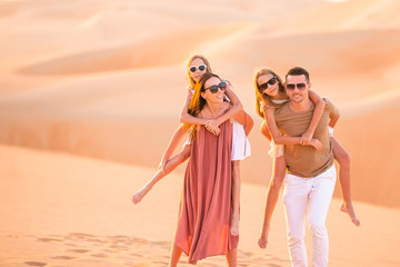 People among dunes in Rub al-Khali desert in United Arab Emirates