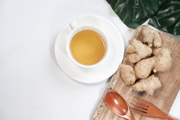 Ginger tea with ginger on table , high angle view .