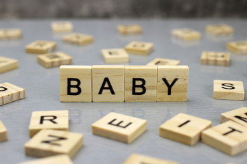 Word baby made of wooden letters