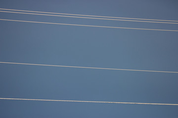 Blue Sky and Telephone Wires in the Sun