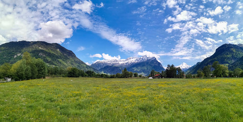 Panorama in canton Uri, Switzerland with swiss Alps and clouds