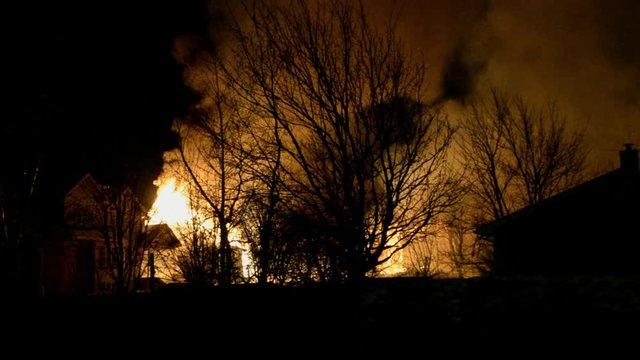 Big Fire of Two Houses Burning During the Night. Huge Flames.