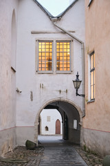 Fototapeta na wymiar Old medieval streets of Tallinn, Baltic tourism center.