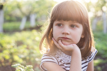 Beautiful little girl in the garden