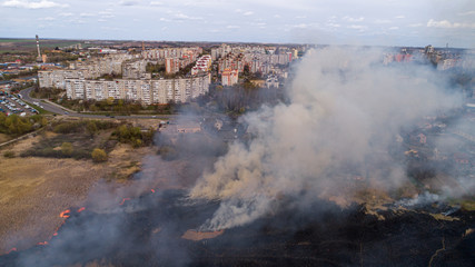 Large-scale fire in the field, lots of smoke and fire Rivne