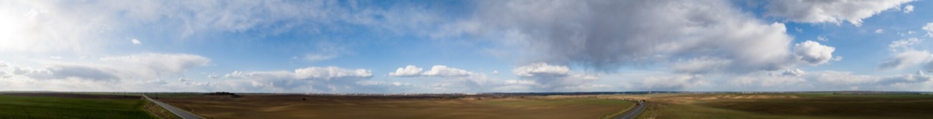 The stormy clouds on sunset panorama