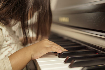 Little girl playing piano