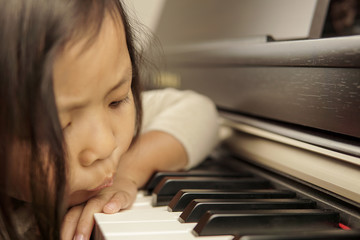 Little girl playing piano