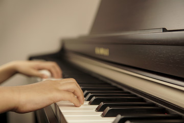 A little boy playing piano