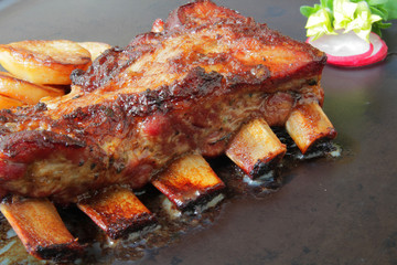 
grilled pork ribs with spices and vegetables