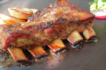 
grilled pork ribs with spices and vegetables