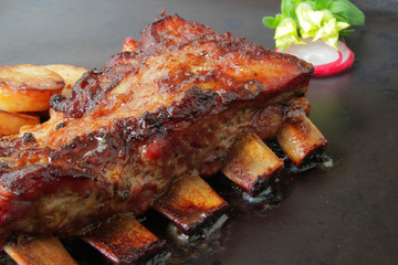 
grilled pork ribs with spices and vegetables
