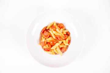 Penne with tomatoes, garlic and mozzarella on a white background