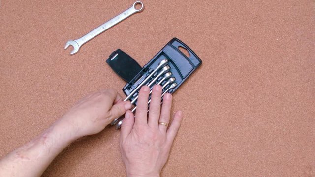 Set of wrenches being set over a cork surface