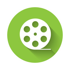 White Film reel icon isolated with long shadow. Green circle button. Vector Illustration
