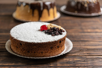 Various cakes on wooden background or table. Assortment of cakes for celebrations.