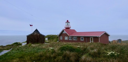 Lighthouse at cape horn in gras landscape, stormy, clouds, Chile © HWL Photos