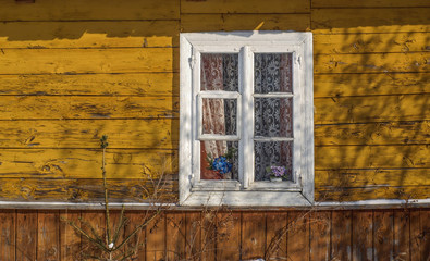White window in a traditional Polish wooden house